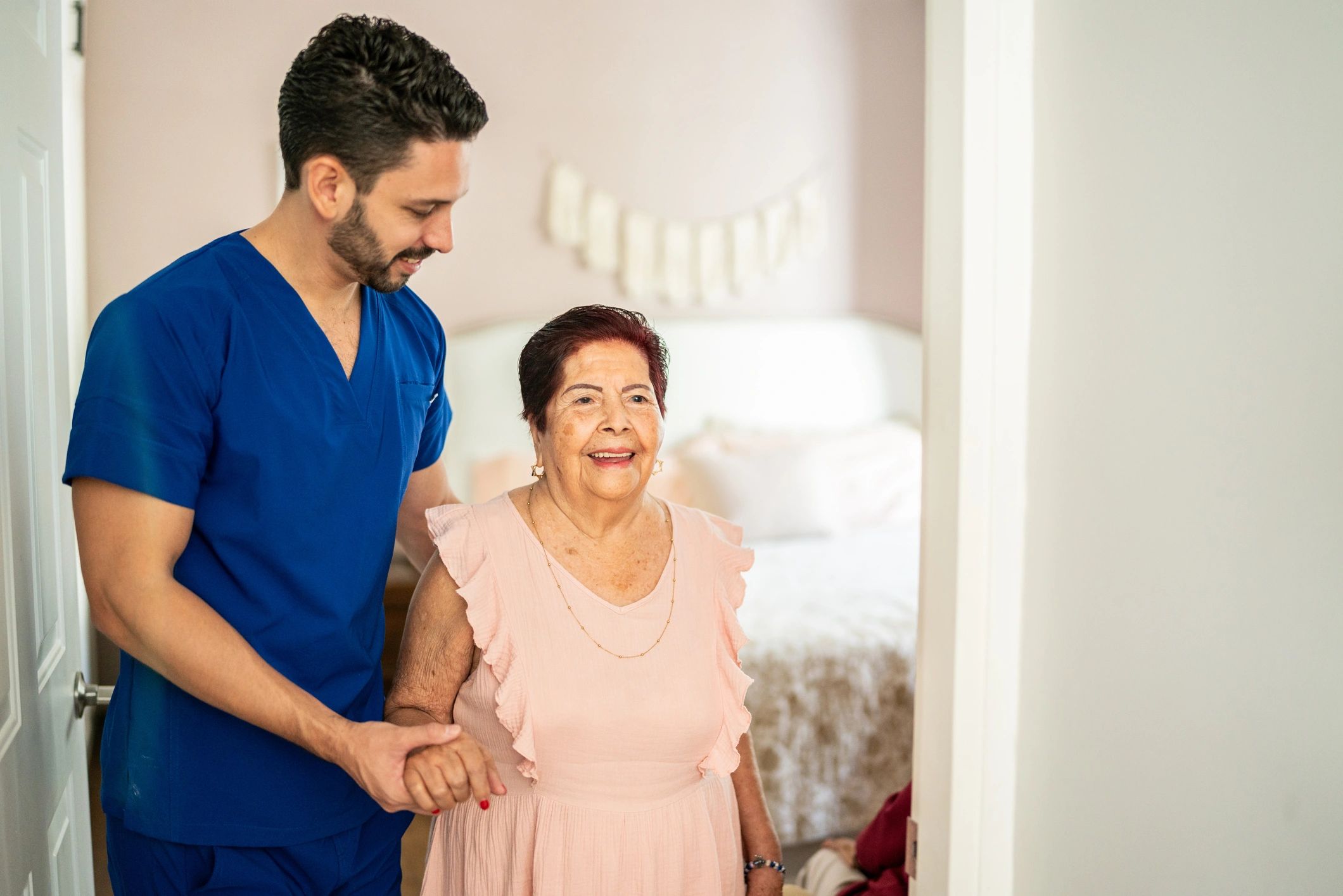 caregiver helping elderly at home