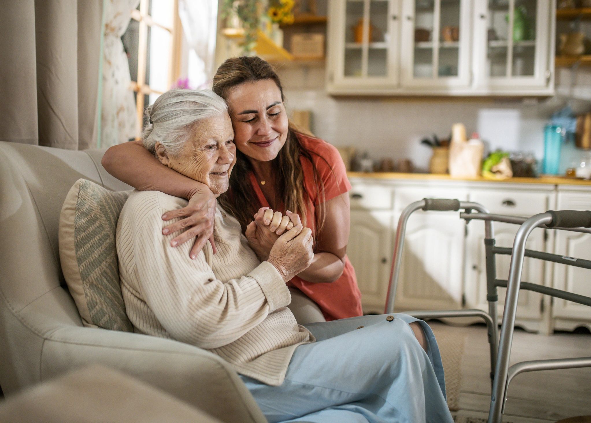 caregiver helping elderly at home